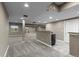 Finished basement featuring neutral carpet, recessed lights, and a support column at 17223 W 84Th Dr, Arvada, CO 80007