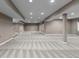 Expansive finished basement with neutral carpet and recessed lighting at 17223 W 84Th Dr, Arvada, CO 80007