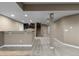 Spacious finished basement showcasing carpet floors, a bar area, and stairs leading to the upper level at 17223 W 84Th Dr, Arvada, CO 80007