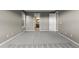 Neutral carpeted bedroom leading to a bathroom and closet at 17223 W 84Th Dr, Arvada, CO 80007