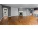 Spacious living room featuring hardwood floors, fireplace, and neutral paint colors at 17223 W 84Th Dr, Arvada, CO 80007