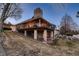 Backyard with a walkout deck and brick pillars at 7769 W 70Th Dr, Arvada, CO 80004