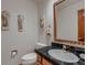 Cozy powder room featuring classic fixtures and traditional design elements at 7769 W 70Th Dr, Arvada, CO 80004