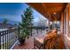Inviting outdoor deck with comfortable seating and scenic views of the surrounding landscape at 7769 W 70Th Dr, Arvada, CO 80004