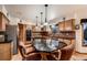 Spacious kitchen with granite counters, wood cabinets and stainless steel appliances at 7769 W 70Th Dr, Arvada, CO 80004