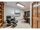 Bright home office featuring comfortable seating and a classic executive desk at 7769 W 70Th Dr, Arvada, CO 80004