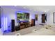 Finished basement with projector, screen, seating, and surround sound system at 12 Long Spur, Littleton, CO 80127