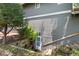 Exterior view of a basement entrance with stone retaining wall and stairs leading to the door at 12 Long Spur, Littleton, CO 80127