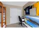 bedroom with bunk bed, desk, closet, and television at 12 Long Spur, Littleton, CO 80127