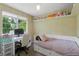 Bedroom featuring a daybed, large window, and desk at 12 Long Spur, Littleton, CO 80127