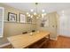 Stylish dining room featuring a modern light fixture and a large wooden table perfect for gatherings at 12 Long Spur, Littleton, CO 80127