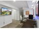 Finished basement office space with built in desk and adjacent storage closet at 12 Long Spur, Littleton, CO 80127
