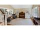 Cozy living room with hardwood floors, large windows with shutters, piano and comfortable seating arrangement at 12 Long Spur, Littleton, CO 80127