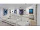 Home theater features tiered seating with reclining chairs and a wet bar area at 12 Long Spur, Littleton, CO 80127