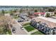 Scenic aerial view of the neighborhood showcasing tree-lined streets, a lake, and charming rooftops at 1640 Winona Ct, Denver, CO 80204