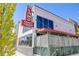 Exterior view of Alamo Draft House Cinema with iconic neon sign, showcasing architecture at 1640 Winona Ct, Denver, CO 80204