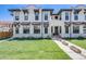 Inviting exterior of a multi-story home with a well-manicured lawn, stone accents, and attractive architectural details at 1640 Winona Ct, Denver, CO 80204