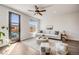 Bright and airy living room with modern furniture, hardwood floors, and a view of the outdoor patio and natural light at 1640 Winona Ct, Denver, CO 80204