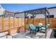 Relaxing outdoor patio area featuring a pergola with cozy seating, perfect for entertaining or enjoying quiet moments at 1640 Winona Ct, Denver, CO 80204