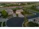 Overhead view of property showcasing neighborhood streetscape, spacious driveways, mature trees, and professional landscaping at 16815 E Prairie Goat Ave, Parker, CO 80134
