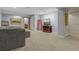 Finished basement showcasing a sofa, television and storage, and a glimpse into the other room at 16815 E Prairie Goat Ave, Parker, CO 80134