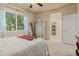 Bright bedroom with natural light and includes a walk-in closet at 16815 E Prairie Goat Ave, Parker, CO 80134