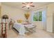 Cozy bedroom with neutral colors, a ceiling fan, and a window with natural light at 16815 E Prairie Goat Ave, Parker, CO 80134