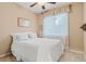 Comfortable bedroom with a ceiling fan, window and sheer curtain at 16815 E Prairie Goat Ave, Parker, CO 80134