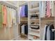 Organized walk-in closet with hanging rods, shelving and storage accessories at 16815 E Prairie Goat Ave, Parker, CO 80134