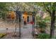 Charming front porch with a beautiful garden entrance, stone accents, and an inviting outdoor seating area at 16815 E Prairie Goat Ave, Parker, CO 80134