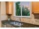 Well-lit kitchen featuring granite countertops, stainless steel appliances, and a window with a view at 16815 E Prairie Goat Ave, Parker, CO 80134