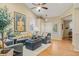 Bright living room with hardwood floors, stylish decor, comfortable seating, and ample natural light at 16815 E Prairie Goat Ave, Parker, CO 80134