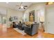 Cozy living room featuring hardwood floors, vaulted ceilings, comfortable seating, and natural light at 16815 E Prairie Goat Ave, Parker, CO 80134