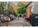 Backyard patio with comfortable seating, covered by a shade canopy perfect for outdoor gatherings at 16815 E Prairie Goat Ave, Parker, CO 80134