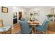 Charming dining room with a round wood table and seating for four at 7427 W Cedar Cir, Lakewood, CO 80226