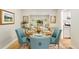 Charming dining room with seating for six features elegant decor and natural light at 7427 W Cedar Cir, Lakewood, CO 80226