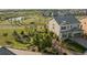 Two-story home with a fenced backyard, a pond, and lush landscaping at 3741 Harvard Pl, Broomfield, CO 80023