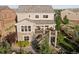 Aerial view of a two-story home with a stone-clad facade and a spacious deck at 3741 Harvard Pl, Broomfield, CO 80023