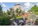 Secluded backyard featuring a fire pit, lush greenery, and beautiful landscaping at 3741 Harvard Pl, Broomfield, CO 80023