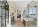 Elegant bathroom showcasing a tub, tile floors, modern fixtures, and a glass shower at 3741 Harvard Pl, Broomfield, CO 80023
