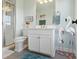 Charming bathroom featuring a glass shower, a flamingo theme, and a white vanity at 3741 Harvard Pl, Broomfield, CO 80023