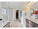 Bright bathroom features a glass shower, walk-in closet, marble countertops, and updated lighting at 3741 Harvard Pl, Broomfield, CO 80023