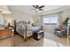 Comfortable bedroom showcases a bed with an ornate wood frame and lots of natural light at 3741 Harvard Pl, Broomfield, CO 80023