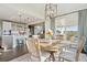 Dining area offering easy access to a modern kitchen, open living space, and outdoor entertaining at 3741 Harvard Pl, Broomfield, CO 80023