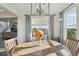 Dining area featuring a round table, statement lighting, and seamless access to an outdoor porch at 3741 Harvard Pl, Broomfield, CO 80023