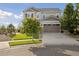 Exterior view of a two-story home showcasing the driveway, front lawn, and garage at 3741 Harvard Pl, Broomfield, CO 80023