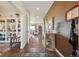Elegant foyer featuring hardwood floors, sophisticated decor, and a glimpse into the inviting living spaces at 3741 Harvard Pl, Broomfield, CO 80023