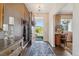 Warm and welcoming foyer with stylish decor, hardwood floors, and a view of the bright front yard at 3741 Harvard Pl, Broomfield, CO 80023