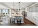 Bright and airy kitchen with a large island, modern appliances, and ample cabinet space for storage at 3741 Harvard Pl, Broomfield, CO 80023