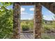 Beautifully landscaped garden view framed by stone pillars, showcasing the serene outdoor space at 3741 Harvard Pl, Broomfield, CO 80023